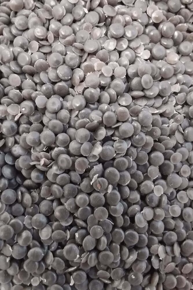 Up close image of pellets used to produce recycled mailing bags.